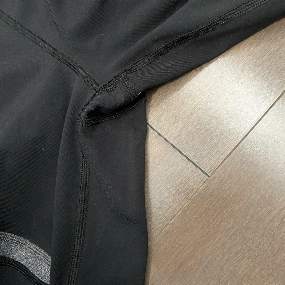 Lululemon leggings with side and back pockets. Size 10 black with gray design. - Picture 5 of 9